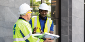 Two contractors reviewing a construction warranty