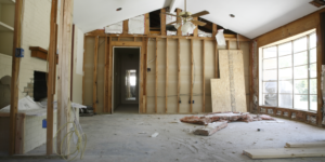 american renovation boom: image of inside of house under construction with exposed beams